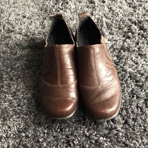 Chocolate brown Romika slip on shoes.